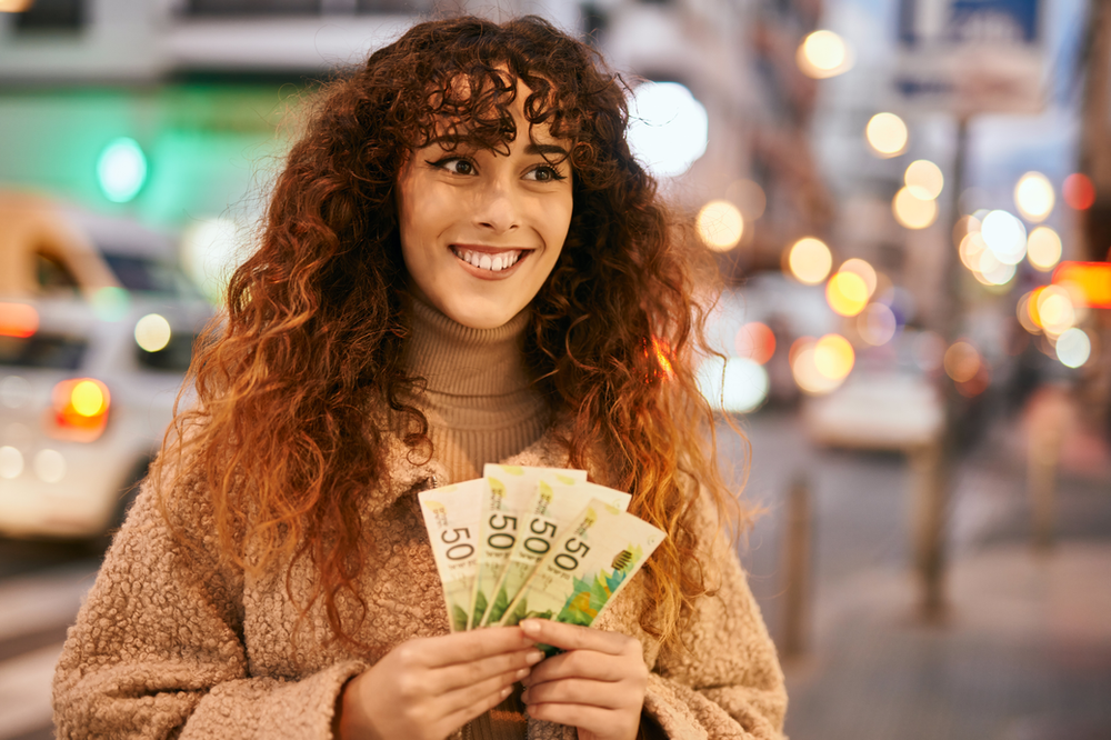 Girl holding cash