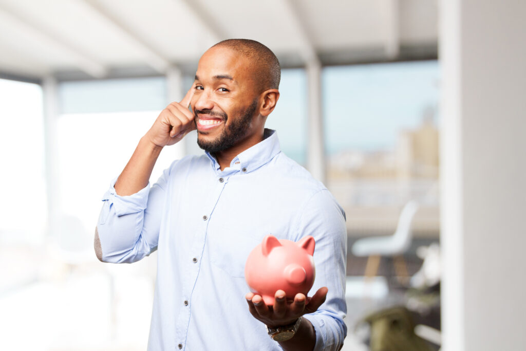 Man holding a piggy bank